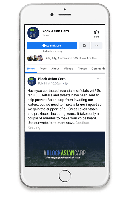 Smart phone with a "Block Asian Carp" Facebook post on screen.