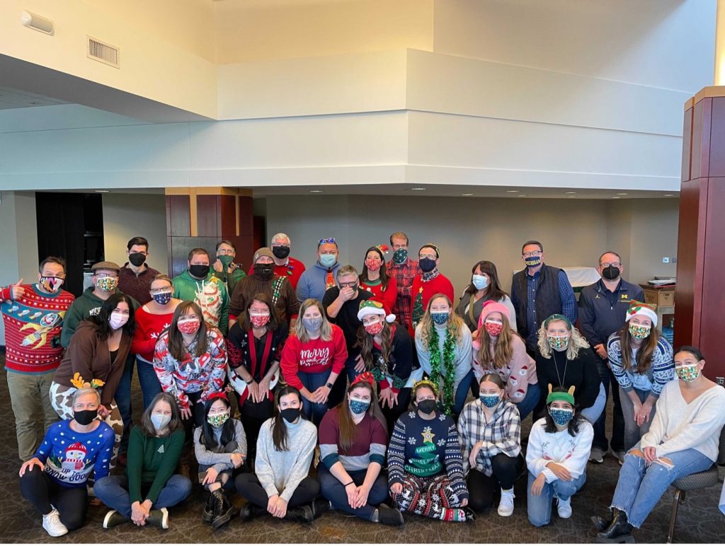 A team photo of Gud marketing staff all wearing mask